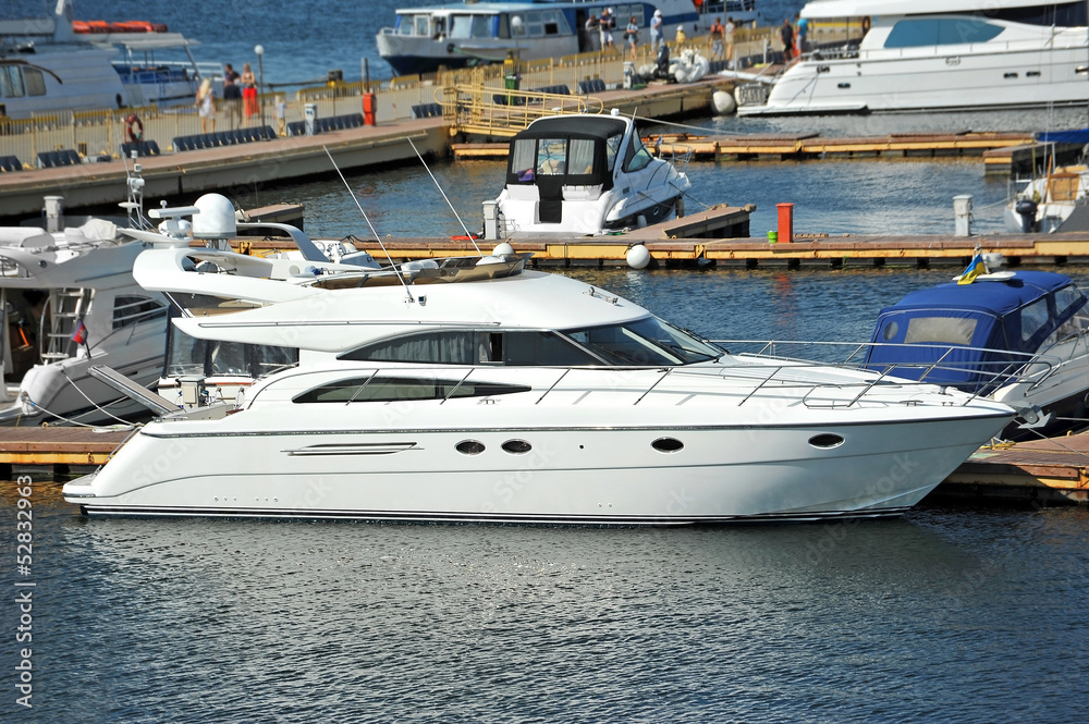 White motor yacht over harbor pier, Odessa, Ukraine White motor yacht over harbor pier, Odessa, Ukraine