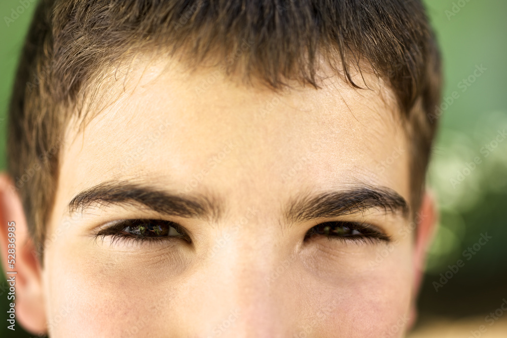 Portrait of serious young boy staring at camera Portrait of serious young boy staring at camera