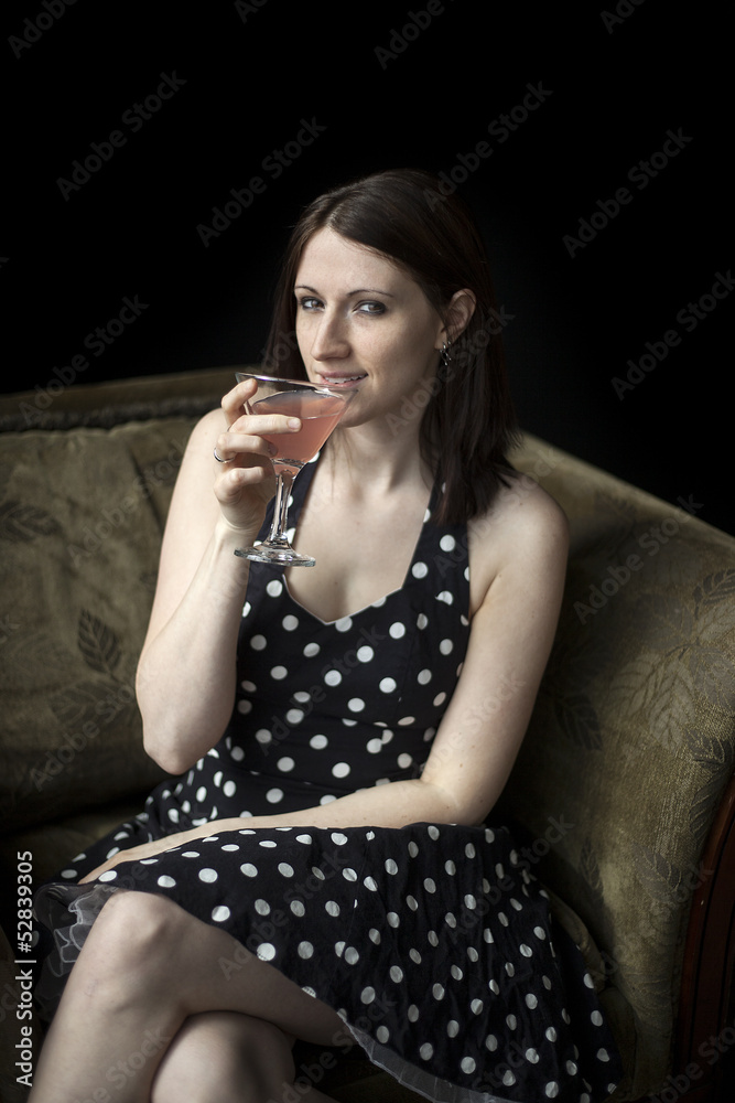 Beautiful Young Woman Drinking a Pink Martini Beautiful Young Woman Drinking a Pink Martini
