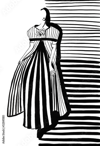 woman in gray coat and dress with pleating photo