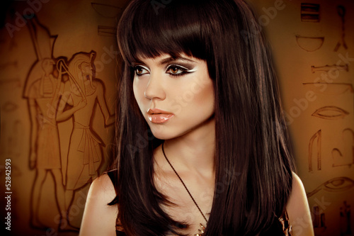 Carta da parati Hair. Beautiful Brunette Girl over Egyptian hieroglyphs