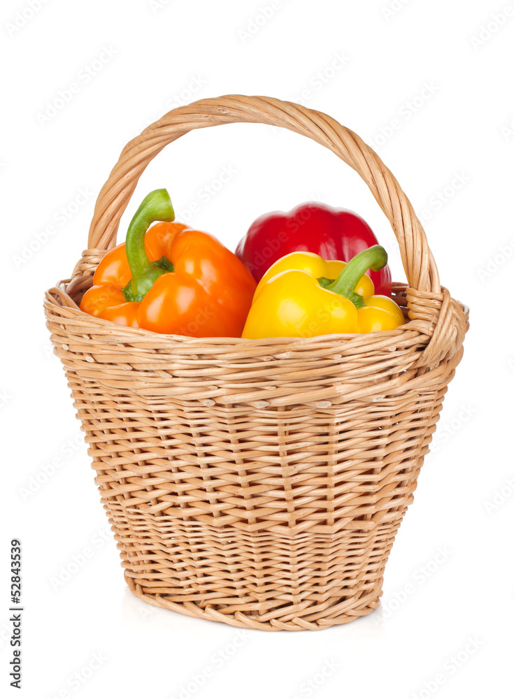 Fresh ripe bell peppers in basket Fresh ripe bell peppers in basket