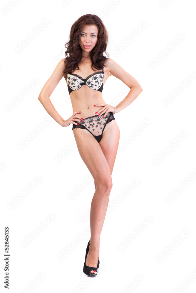 Beautiful underwear model posing on a white Beautiful underwear model posing on a white