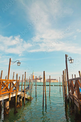 Pier for gondola boats at canal in Venice. Italy. © ysbrandcosijn