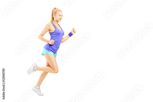 Full length portrait of a young female running