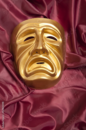 Golden tragedy theatrical mask