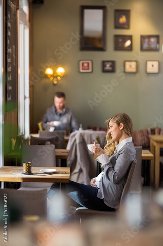 Pregnant Woman Having Coffee While Looking Away