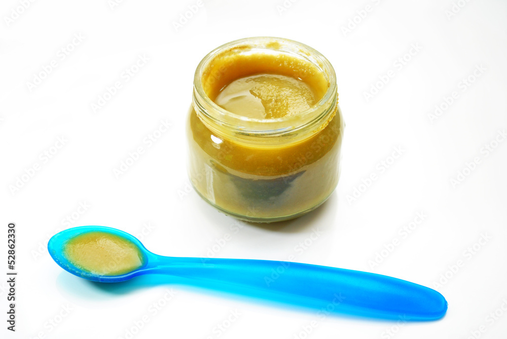 Green Baby Food with a Blue Spoon Green Baby Food with a Blue Spoon