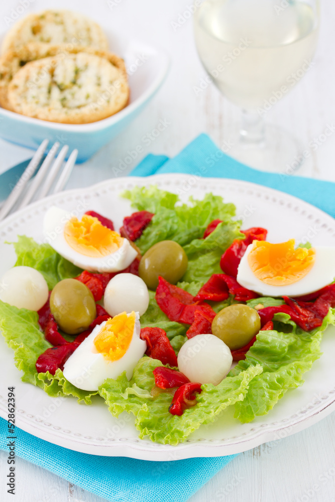 salad with boiled egg, grilled pepper and olives