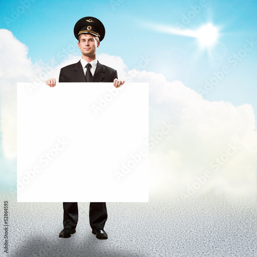 pilot in the form of holding an empty billboard photo