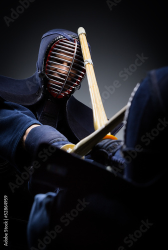 Close up view of competition of two kendo fighters