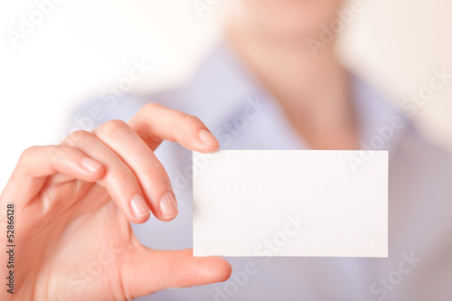 Business women handing a blank business card