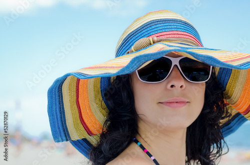 Pretty woman wearing a colourful sunhat