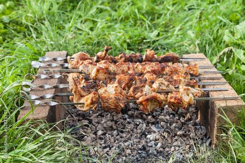 Shish kebab on the improvised oven made of brick