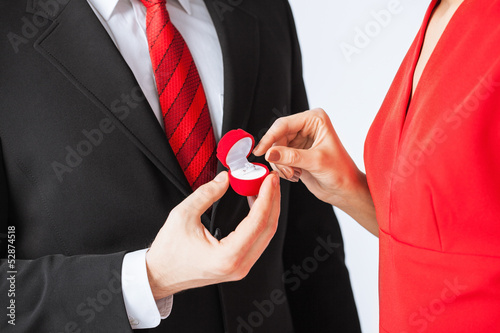 couple with wedding ring and gift box