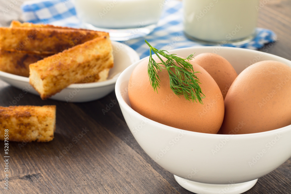 Eggs and milk on wooden background Eggs and milk on wooden background