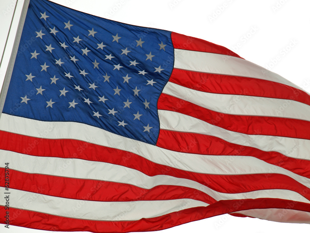 Fototapeta premium American Flag Flying Proudly in the Wind