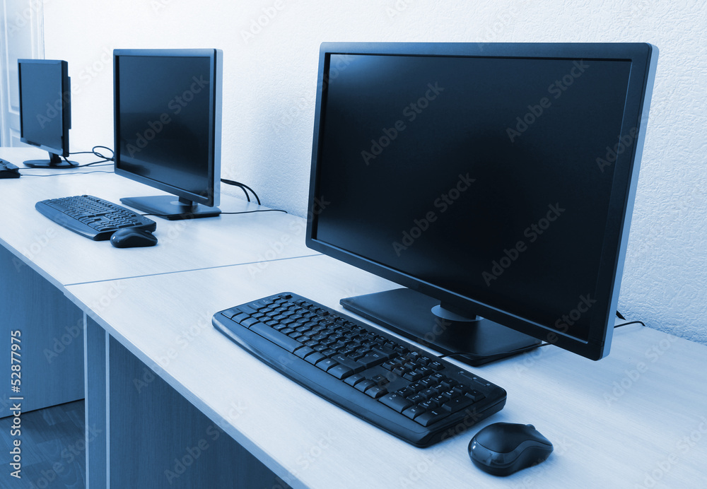 Fototapeta premium Computers on tables in room