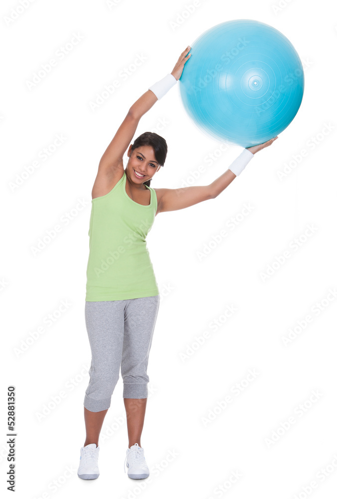 Young Woman Exercising With Pilates Ball