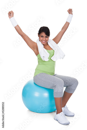 Young Woman Sitting On Pilates Ball