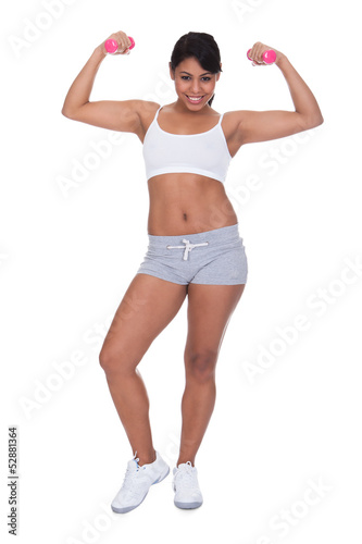 Young Woman Exercising With Dumbbells