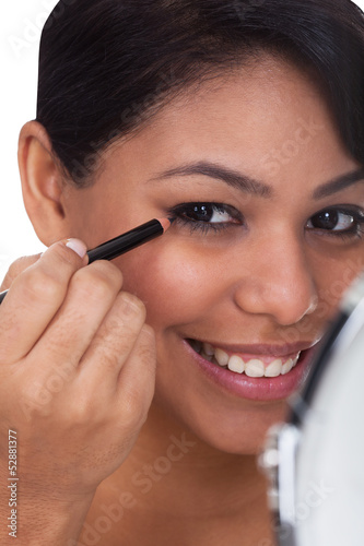 Young Woman Apply Make-up © Andrey Popov