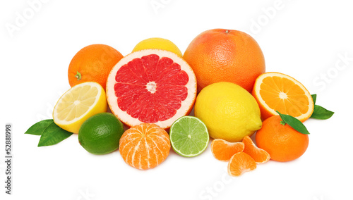 Pile from different citrus fruits on white background