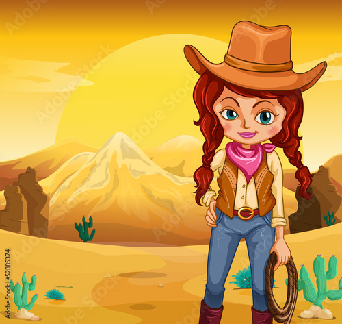 A cowgirl holding a rope standing in the desert