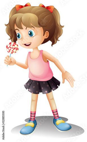 A cute little girl holding a lollipop