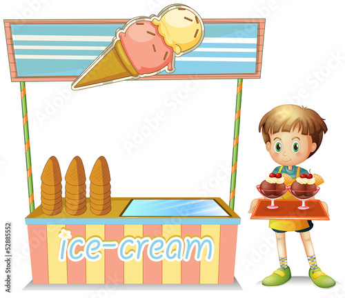 A boy with a tray beside an ice cream cart