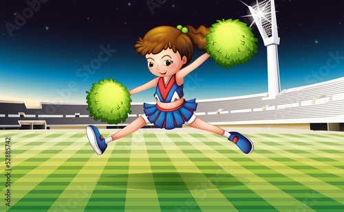 A soccer field with a pretty cheerdancer