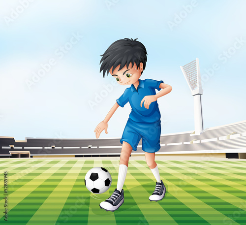 A young gentleman playing soccer