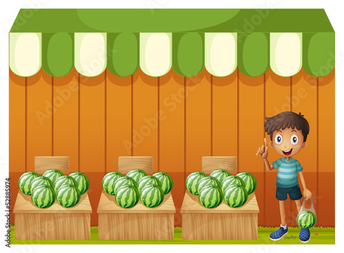 A kid at the watermelon fruitstands