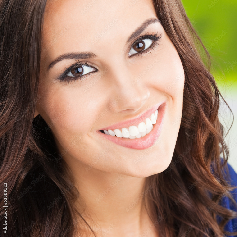 Happy smiling young woman, outdoors Happy smiling young woman, outdoors