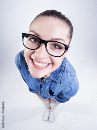 pretty girl with perfect teeth wearing geek glasses smiling