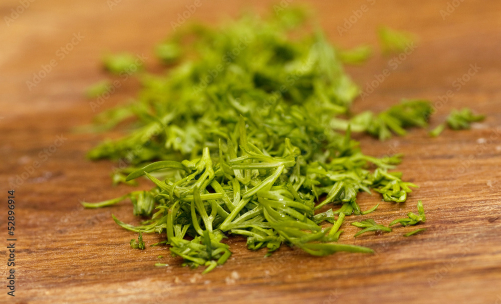 Fresh cut dill on wooden table