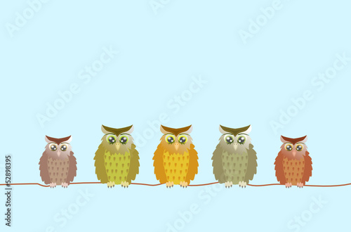few brown owls sitting on a line