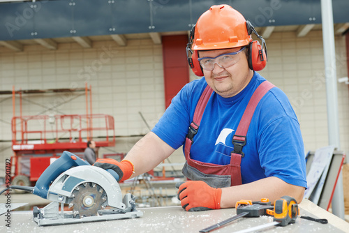 Portrait of builder worker at construction site photo