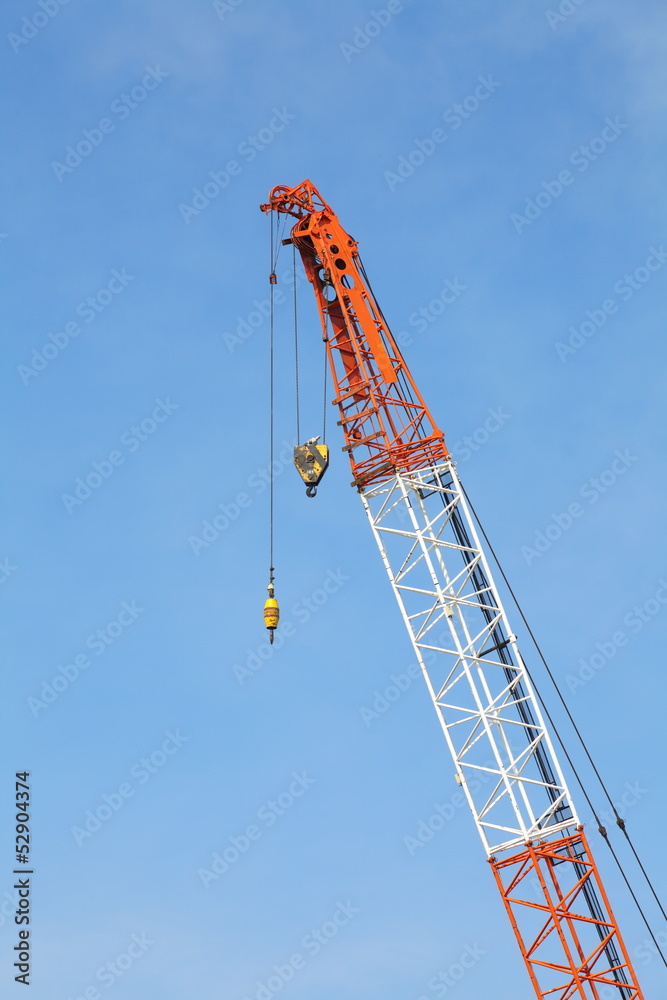 The site with cranes against blue sky The site with cranes against blue sky