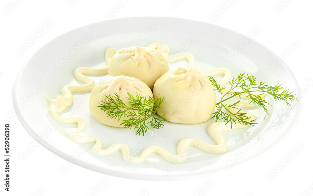 Tasty khinkali on plate, isolated on white Tasty khinkali on plate, isolated on white