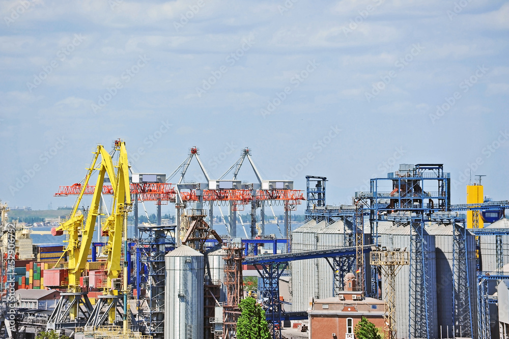 Cargo crane and grain dryer in port Odessa, Ukraine Cargo crane and grain dryer in port Odessa, Ukraine