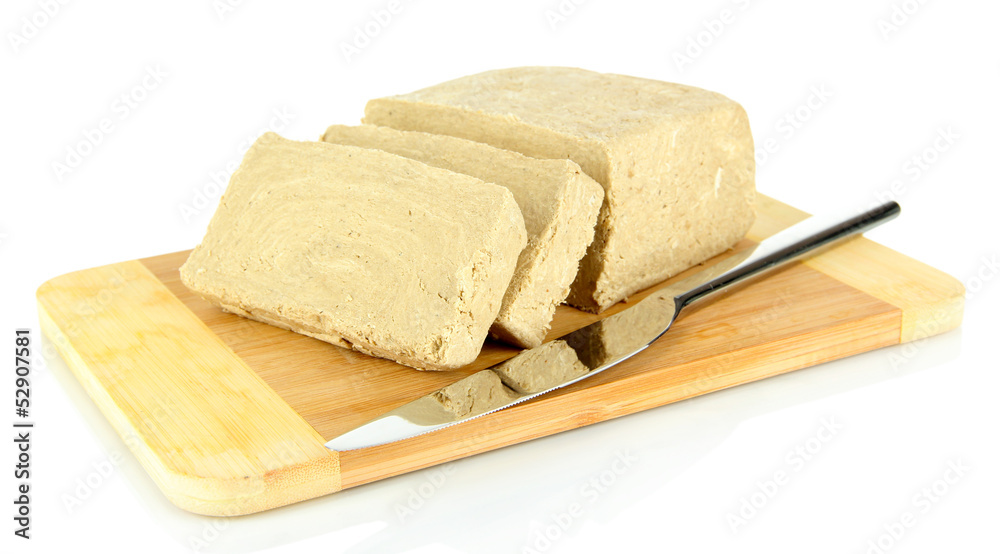 Tasty halva on cutting board isolated on white Tasty halva on cutting board isolated on white