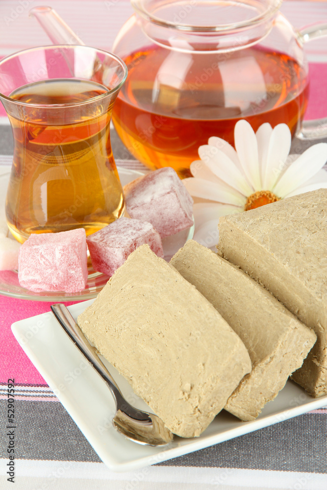 Tasty halva with tea on table close-up Tasty halva with tea on table close-up