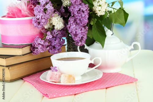 Fototapeta Naklejka Na Ścianę i Meble -  Composition with beautiful lilac flowers, tea service