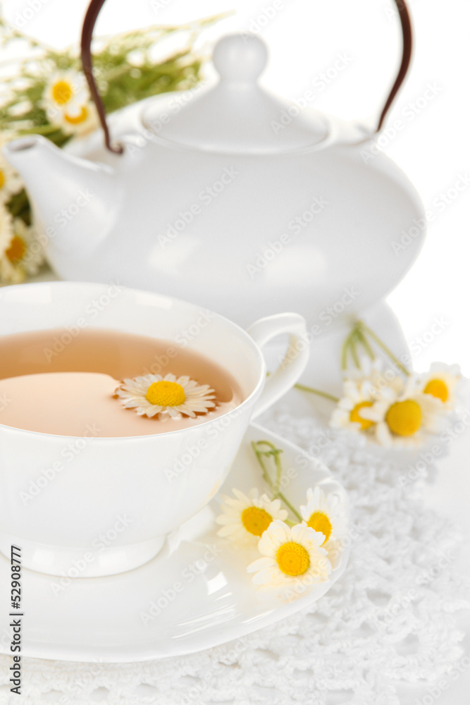 Cup of herbal tea with camomiles close up Cup of herbal tea with camomiles close up