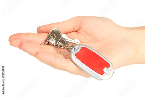 Keychain with house keys in hand isolated on white