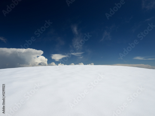 Snow and cloudy sky. Beautiful winter landscape