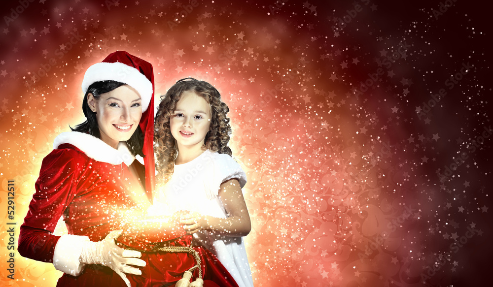 Little girl with christmas gifts and santa Little girl with christmas gifts and santa