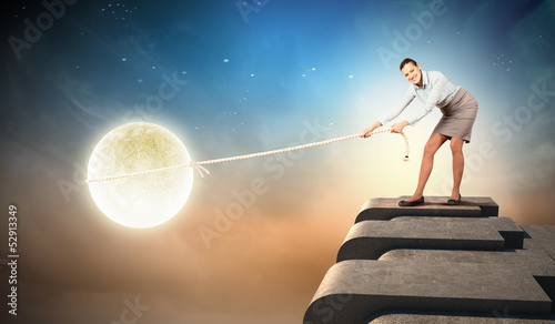 Tableau sur toile Woman pulling moon