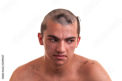 young man is disappointed that the barber by mistake wrong cut h